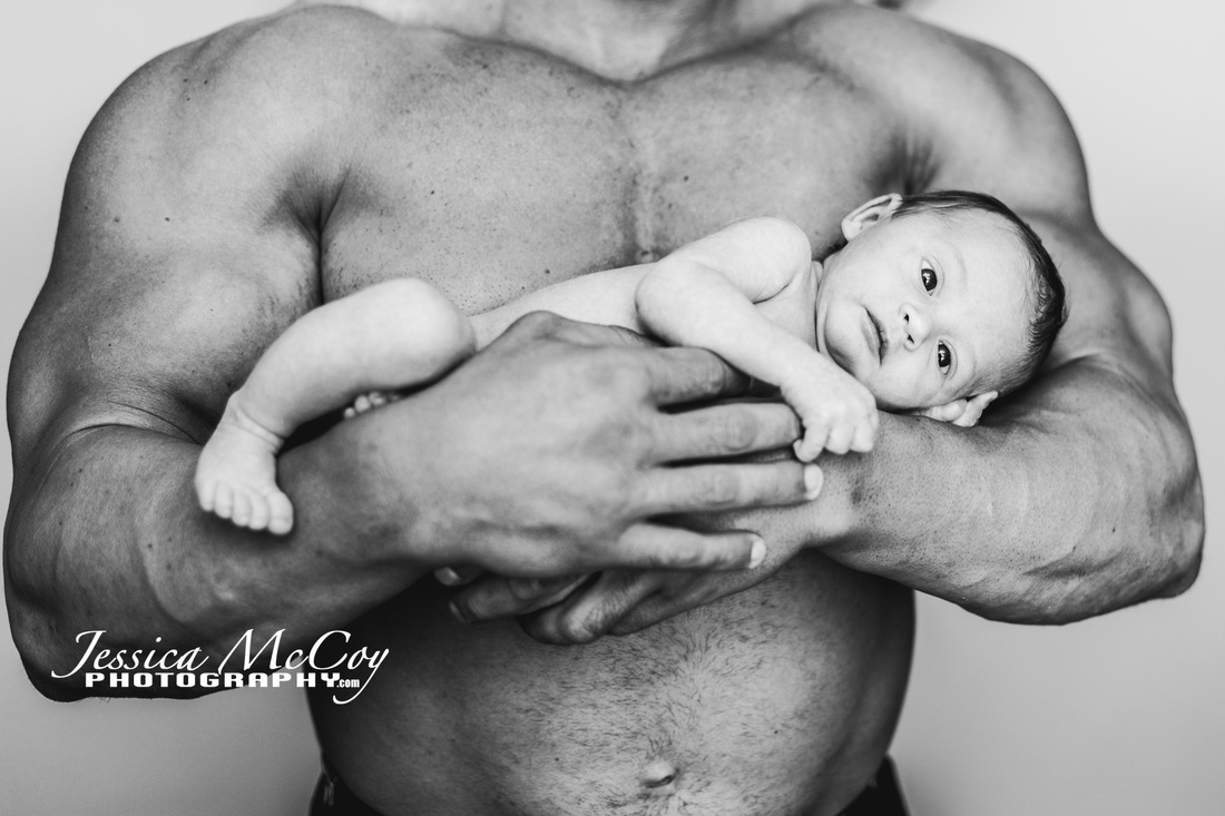 Governors Cup body building winner with newborn son